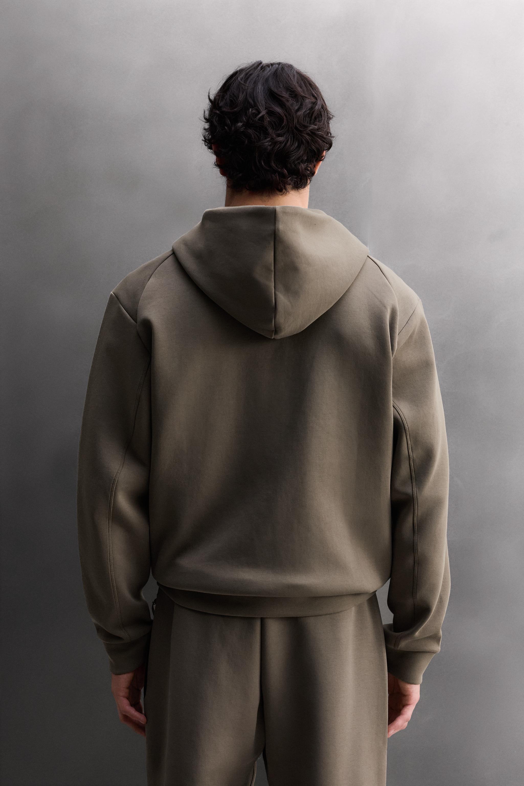 SWEAT TECHNIQUE ZIPPÉ À CAPUCHE